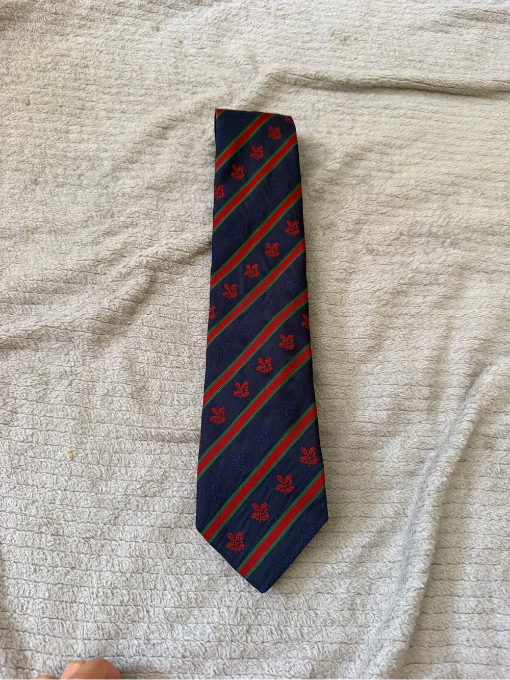 Navy Diagonal Stripe Tie with Red Crest Detail